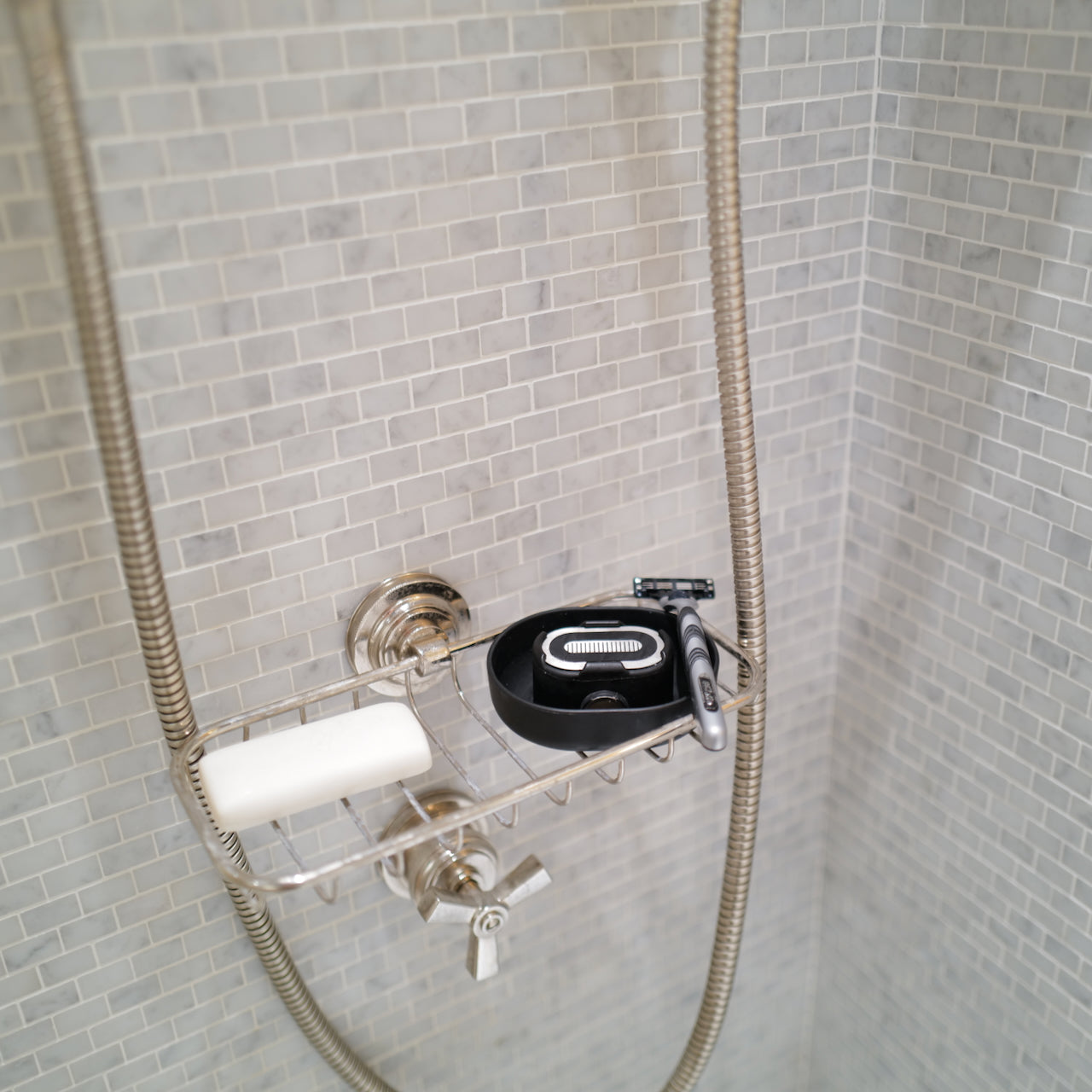 A Razor Rinser in the shower, showing that you can use the Razor Rinser no matter where or how you shave.
