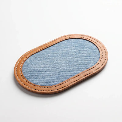 The denim and leather Razor Strop, denim side up with its stitched leather border