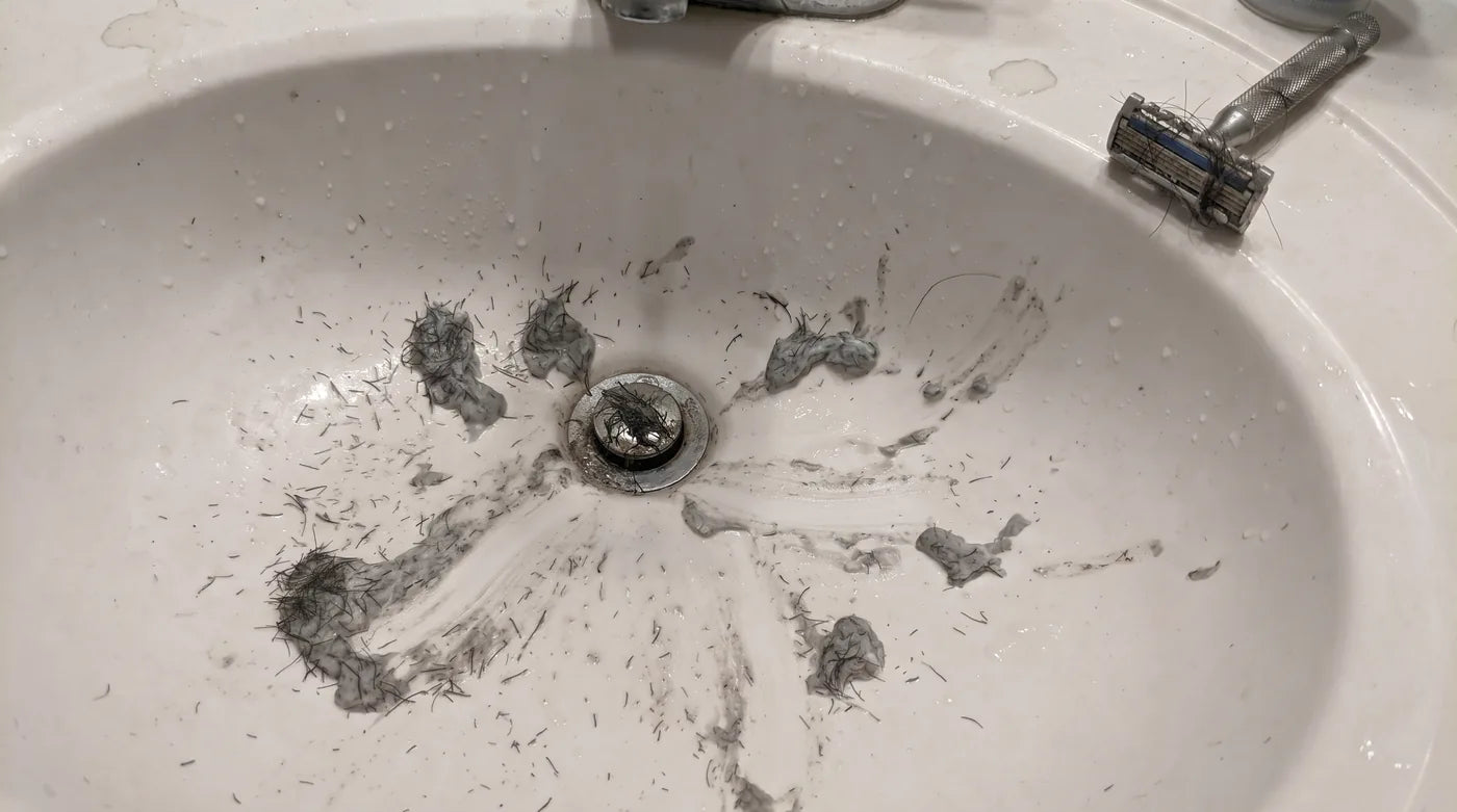 Stubble and shaving cream left all over the sink